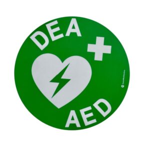 Autocollant adhésif rond (120 mm) de couleur verte avec logo défibrillateur normalisé.